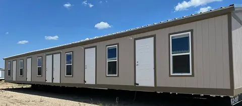 Exterior of a 16×76 5-bed crew unit with shared kitchen