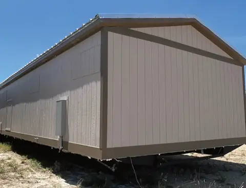Exterior end of a 16×76 5-bed crew unit with shared kitchen