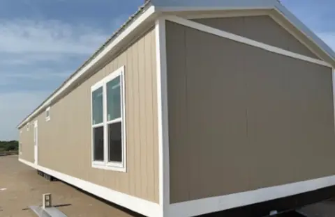 Exterior of a 16×76 HUD-code 5-bed unit with shared kitchen