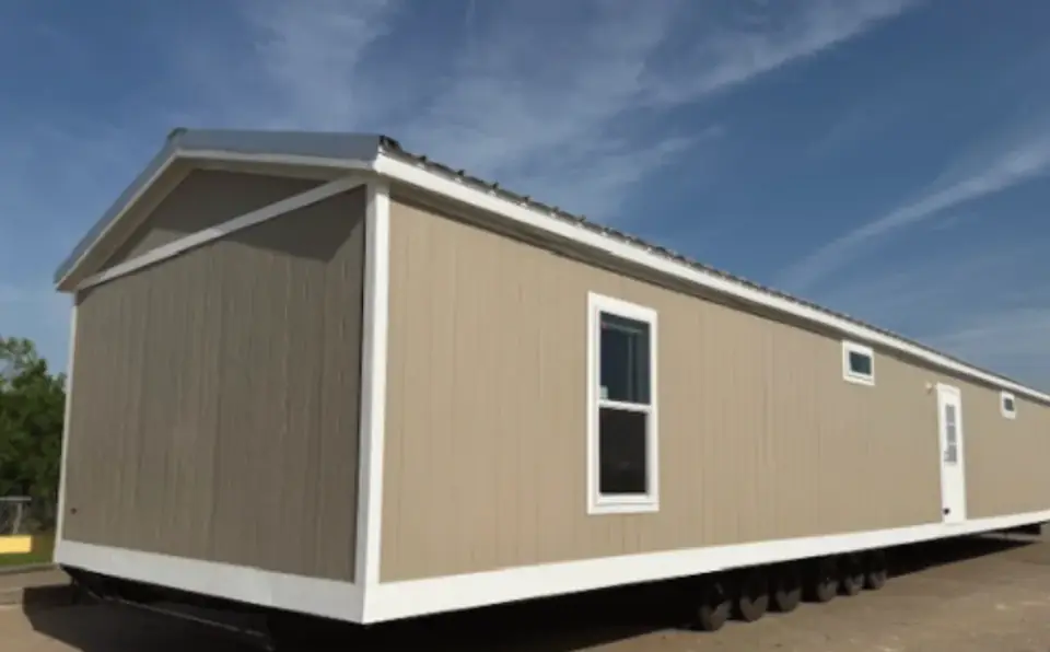 Exterior of a 16×76 HUD-code 5-bed unit with shared kitchen