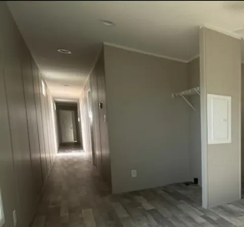 Hallway and kitchen of a 16×76 HUD-code 5-bed unit with shared kitchen