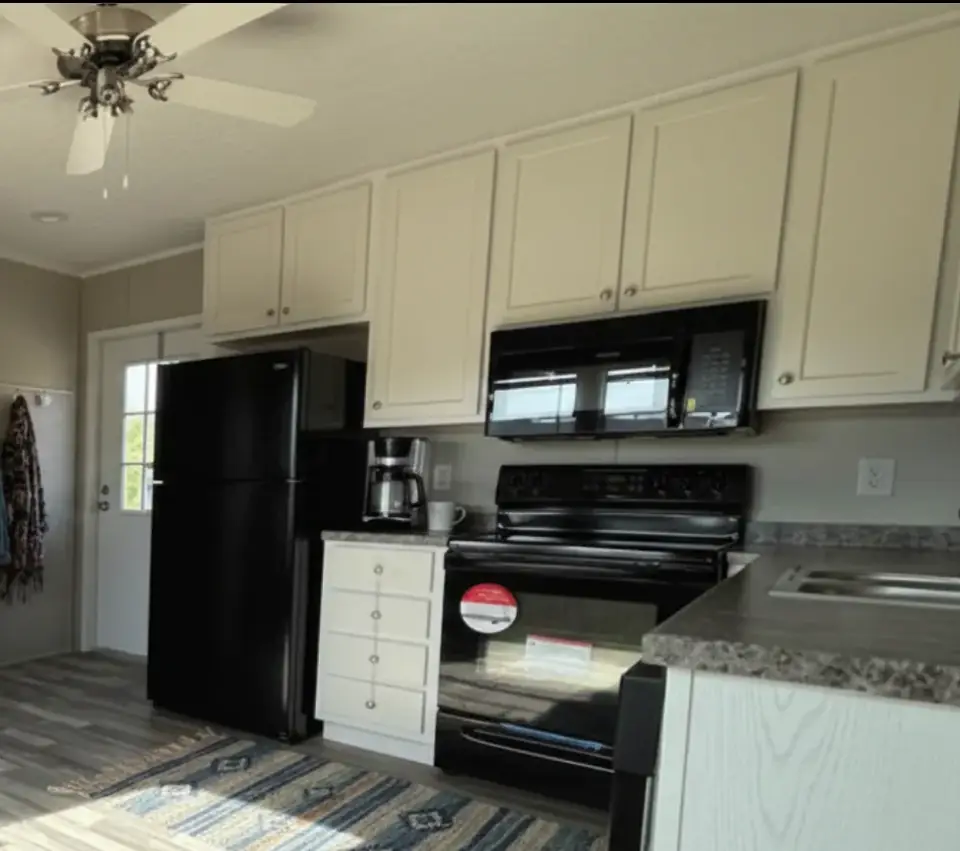 Shared kitchen of a 16×76 HUD-code 5-bed unit with shared kitchen