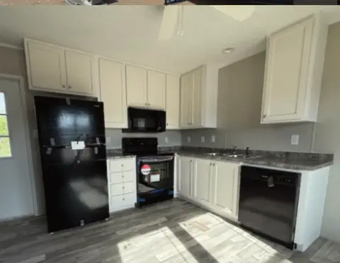 Shared kitchen of a 16×76 HUD-code 5-bed unit with shared kitchen