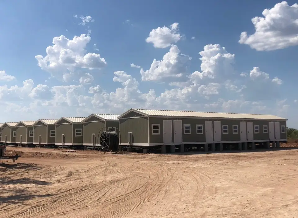 Row of factory-built crew housing units on a Texas job site
