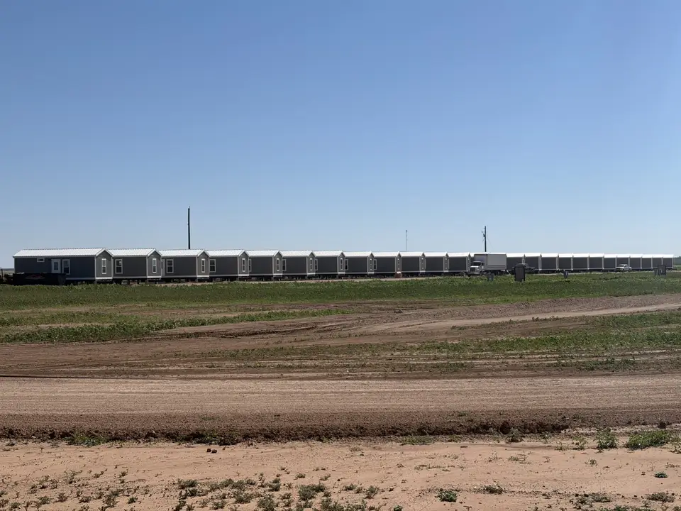 Row of factory-built crew housing units on a Texas job site