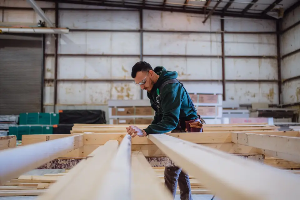Housing unit being built and set by a Texas factory crew