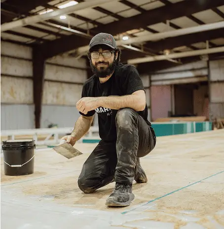 Housing unit being built and set by a Texas factory crew